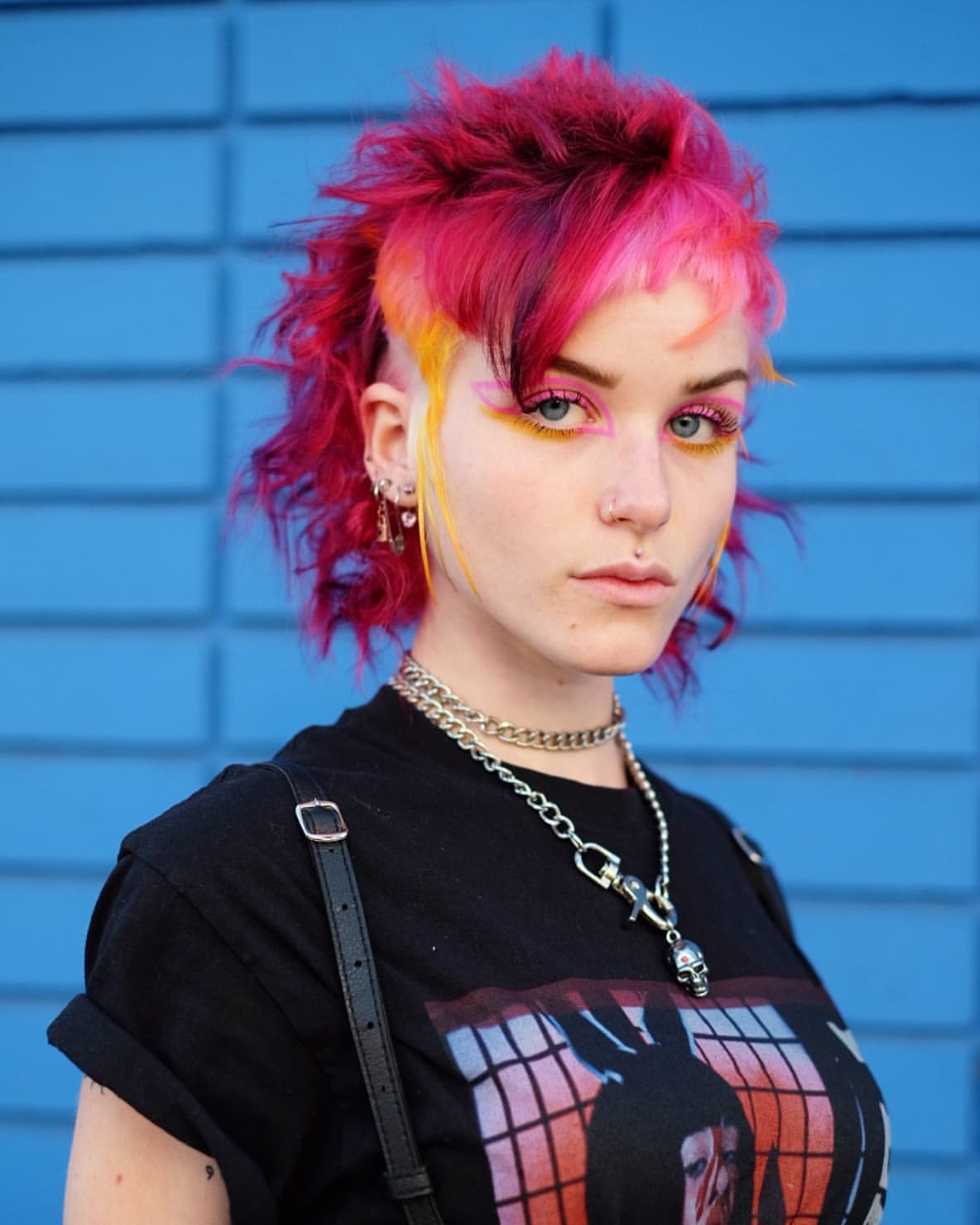 16. Neon Pink Shaggy Pixie Mullet with Flame Streaks
