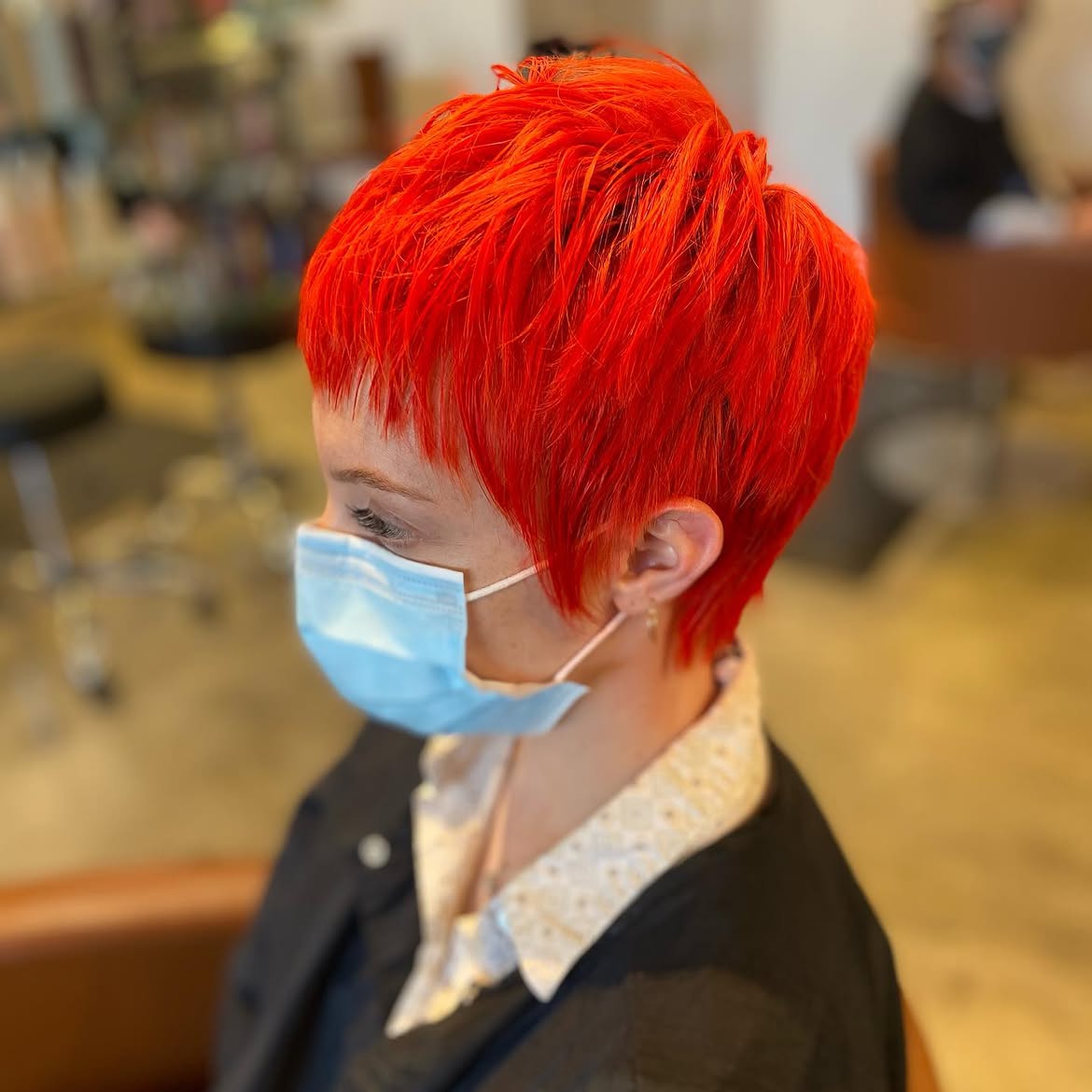 19. Neon Tangerine Choppy Pixie Mullet