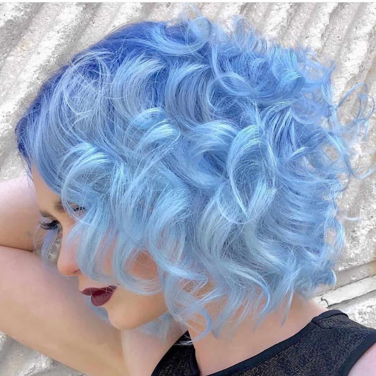 10. Pastel Blue Curly Bob with Shadow Roots