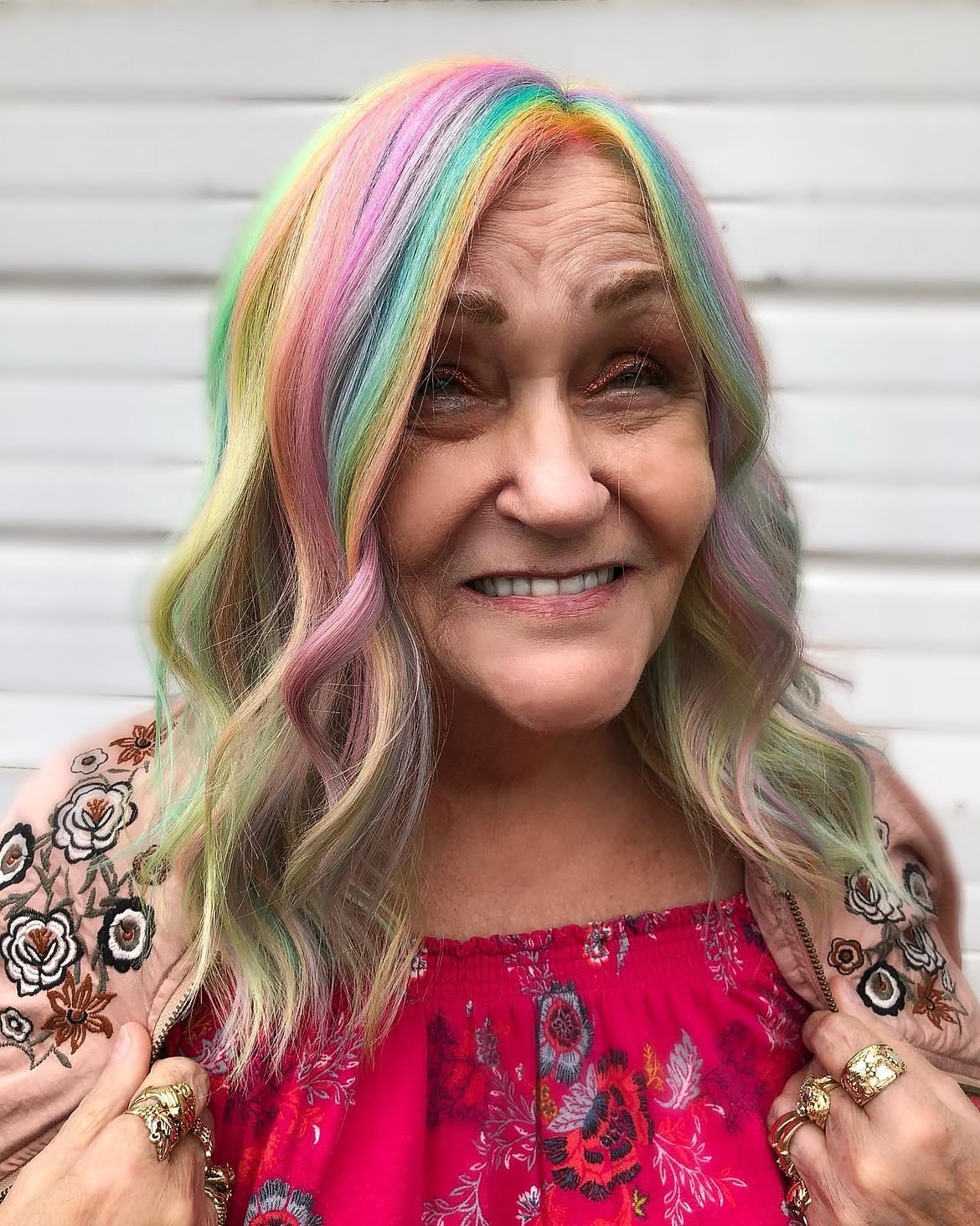 10. Pastel Rainbow Wavy Lob with Face-Framing Stripes