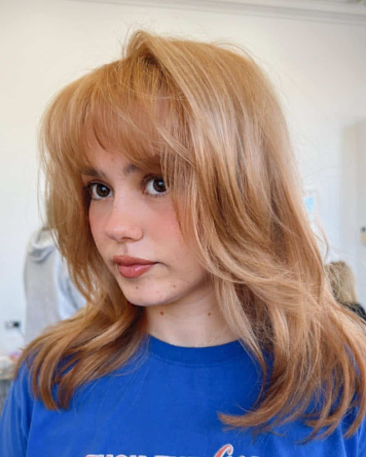 3. Peachy Layers with Soft Bangs