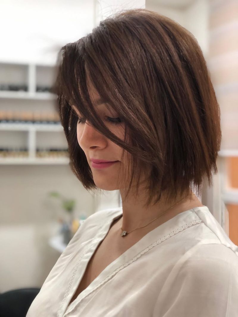 33. Piece-Cut Bob with Side-Swept Bangs