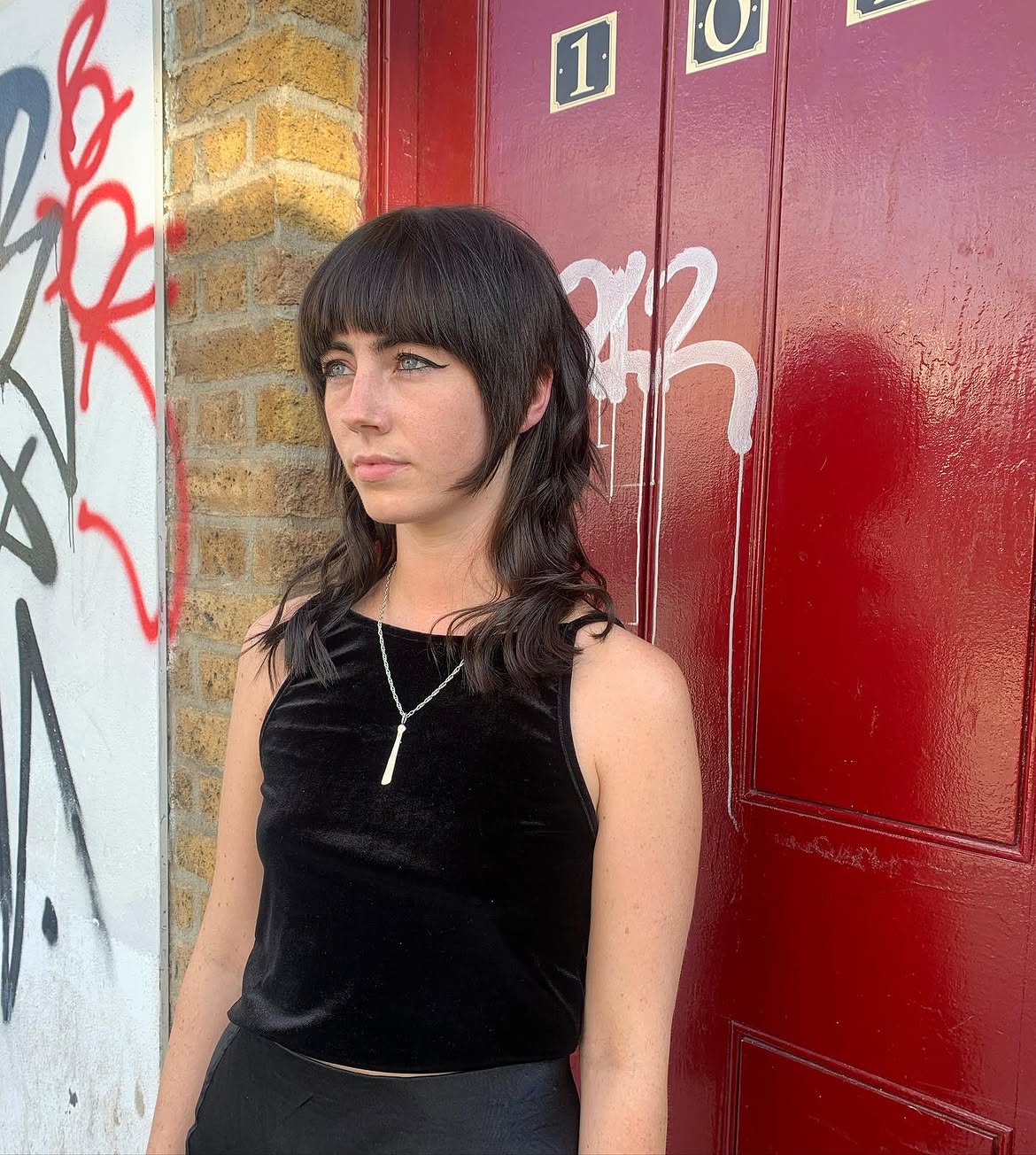 30. Piecey Brunette Shag with Full Bangs