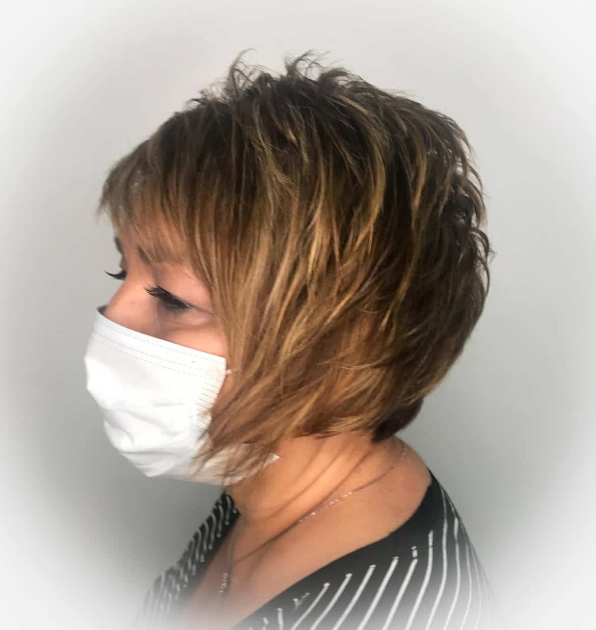 2. Piecey Layered Bob with Wispy Bangs