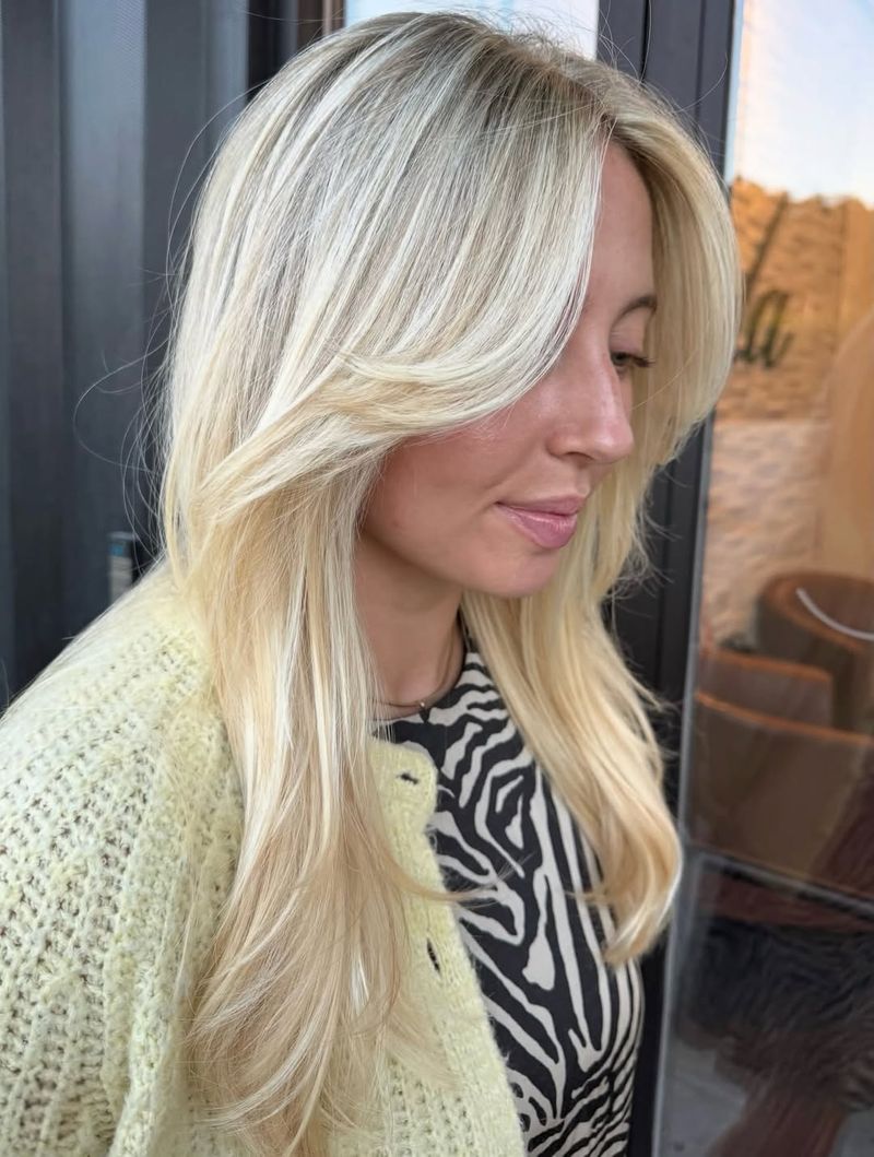 67. Platinum Blonde Curtain Bangs with Long Layers