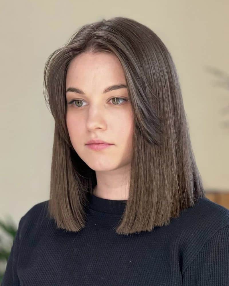 42. Polished Lob with Face-Framing Curtain Layers