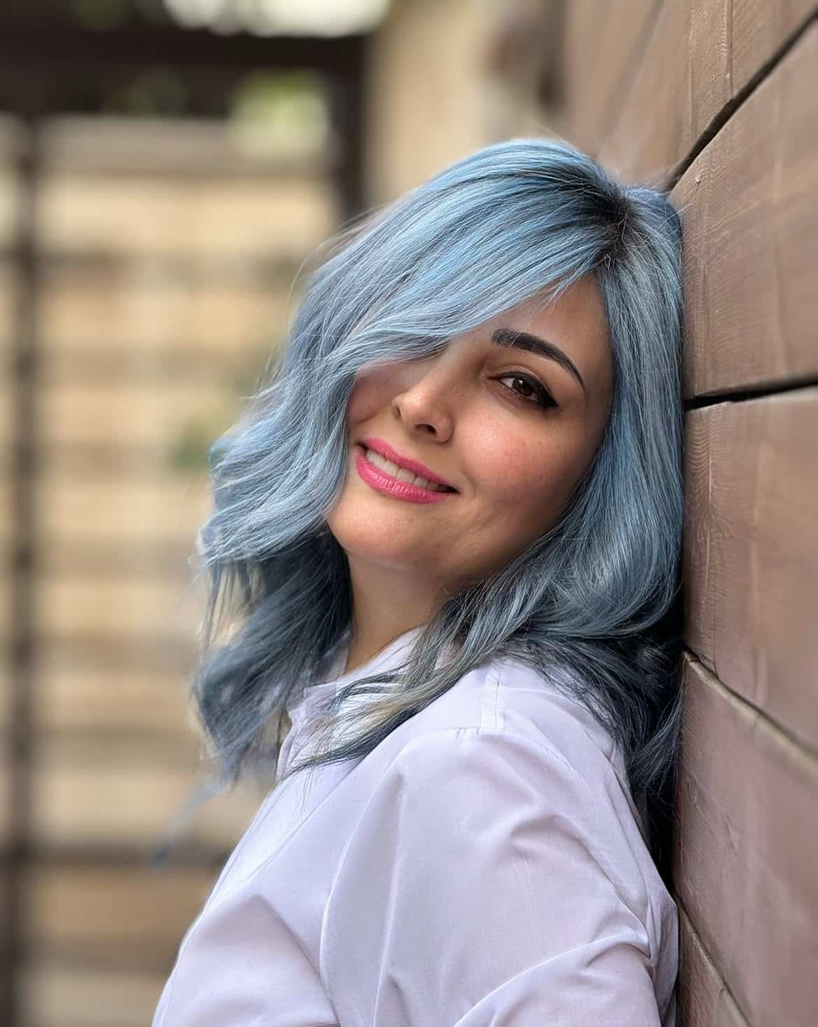 13. Powder Blue Waves with Side-Swept Bangs