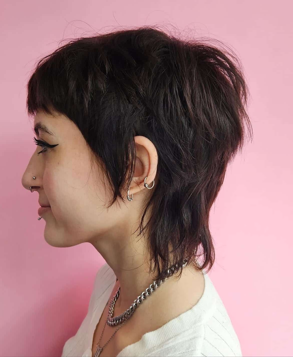 14. Raven Shag Pixie Mullet with Baby Bangs