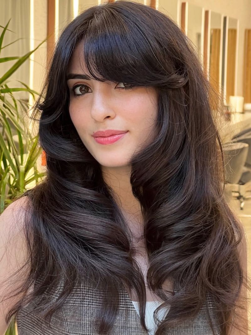 57. Retro Blowout Layers with Side-Swept Fringe