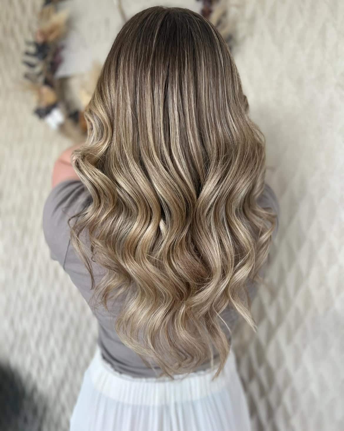 50. Rooted Beige Blonde Balayage Waves