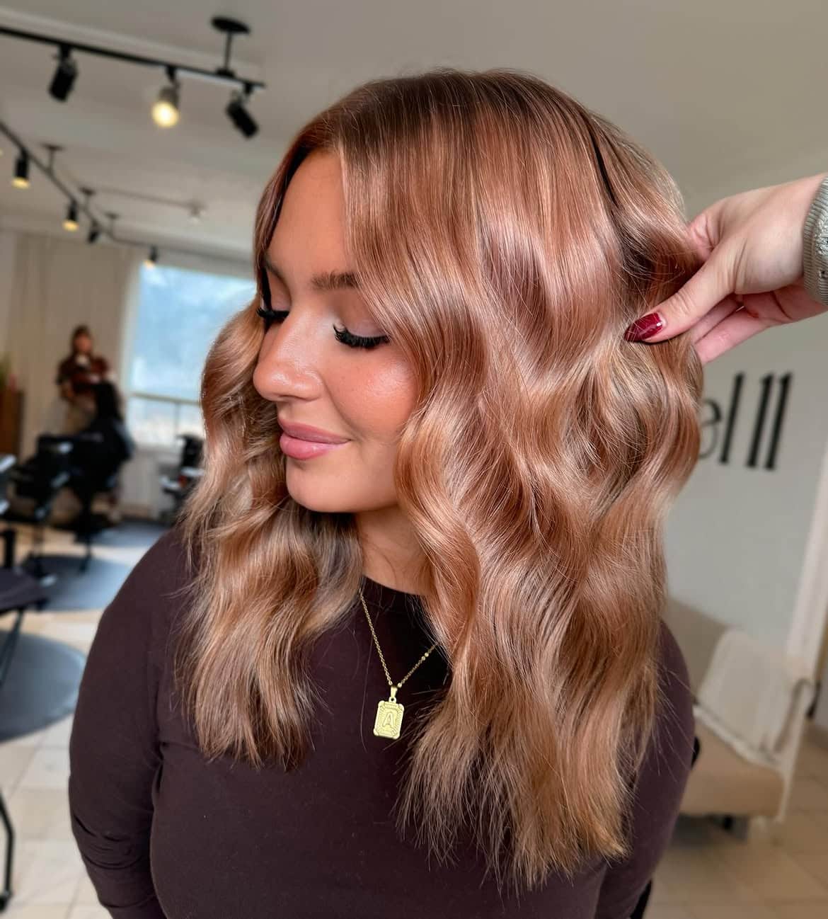 18. Rose Gold Waves with Curtain Bangs