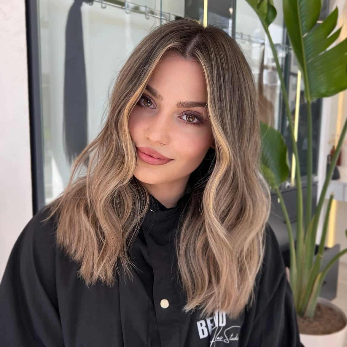 45. Sandy Beige Waves with Bright Money Pieces