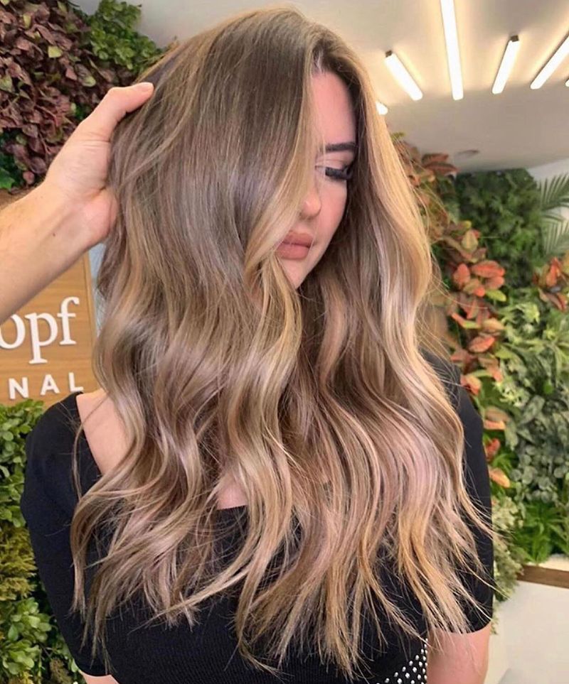 68. Sandy Blonde Balayage with Face-Framing Highlights