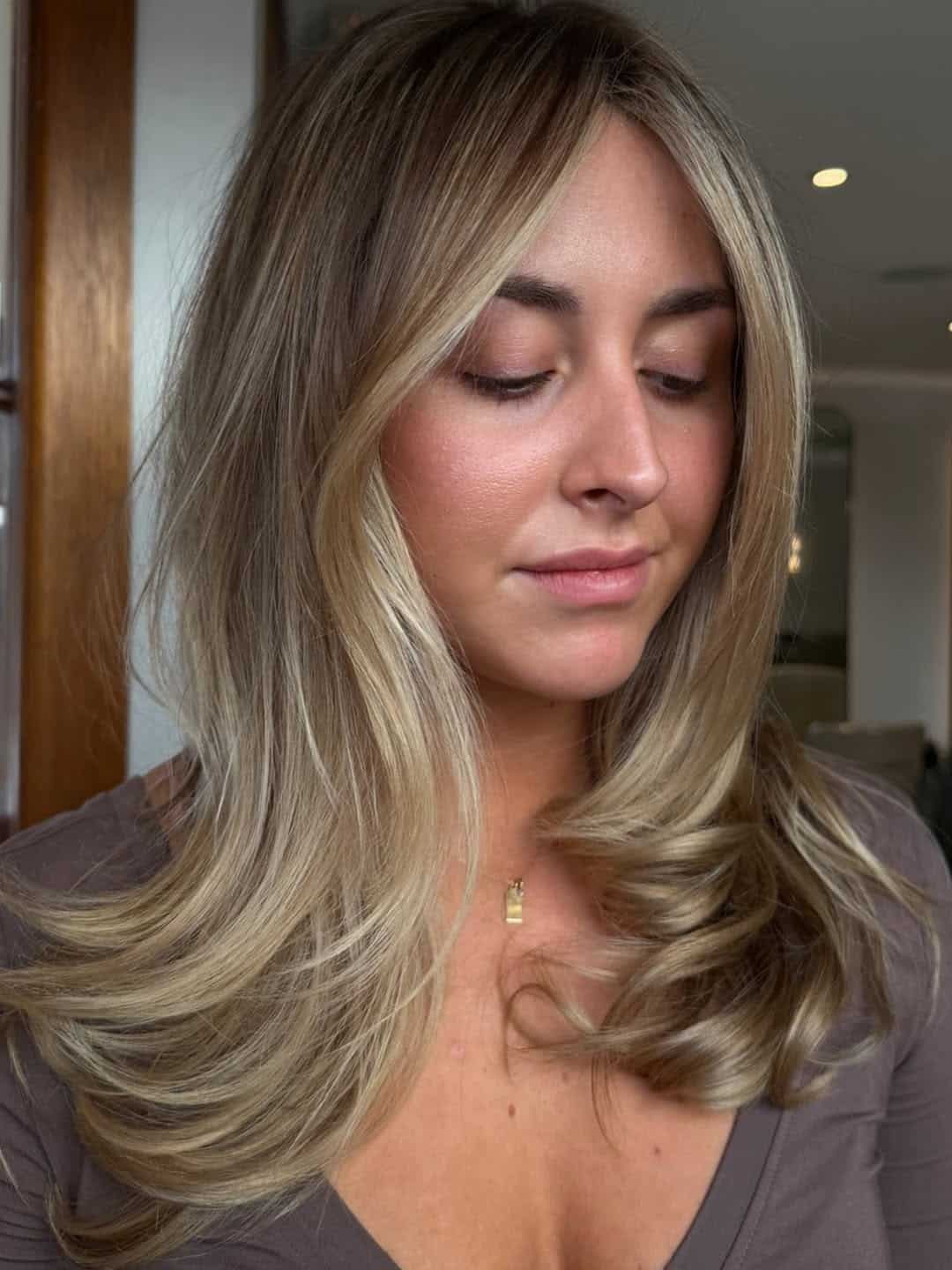 36. Sandy Blonde Layers with Bright Money Pieces