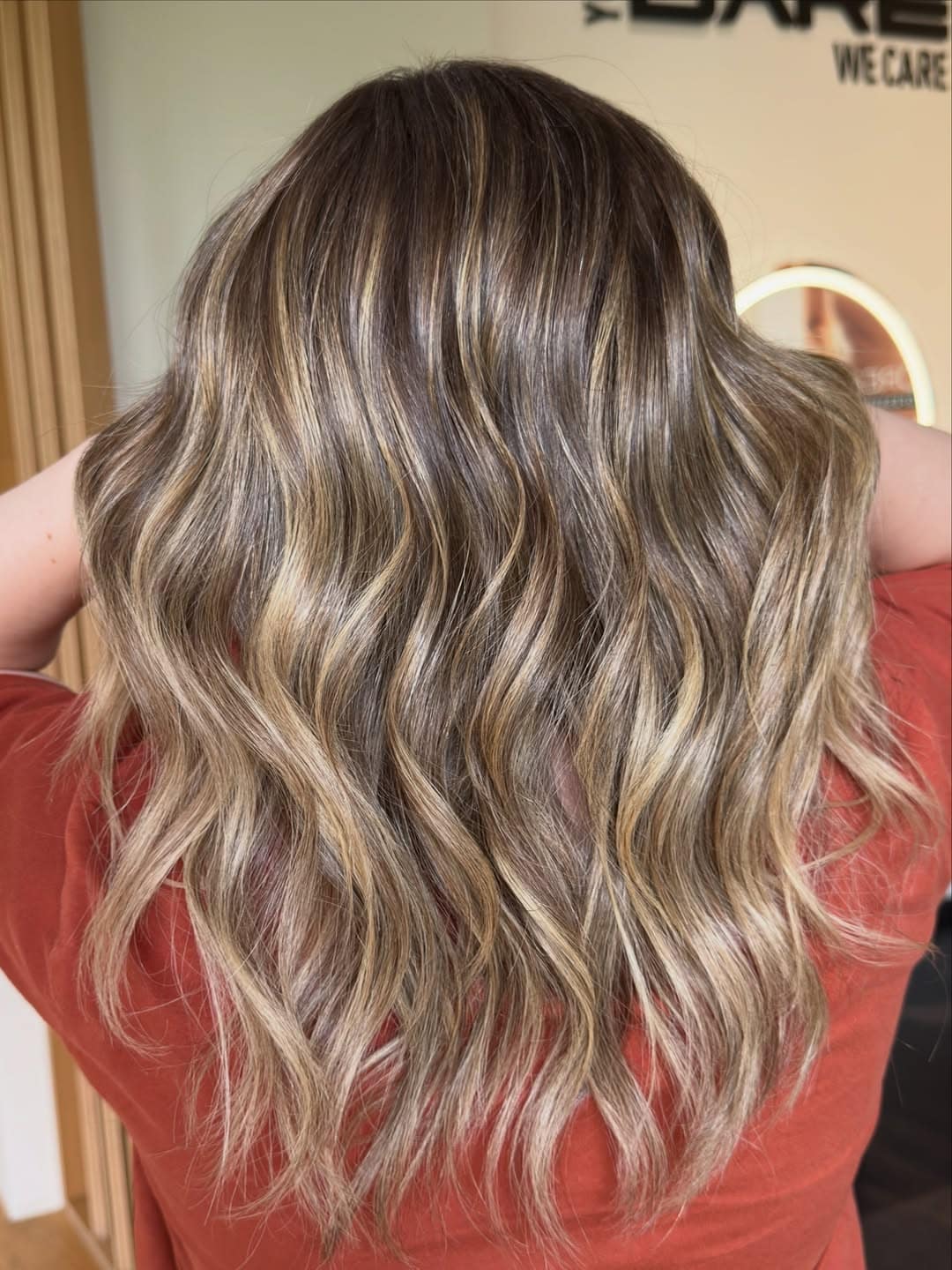 50. Sandy Blonde Waves with Dark Roots