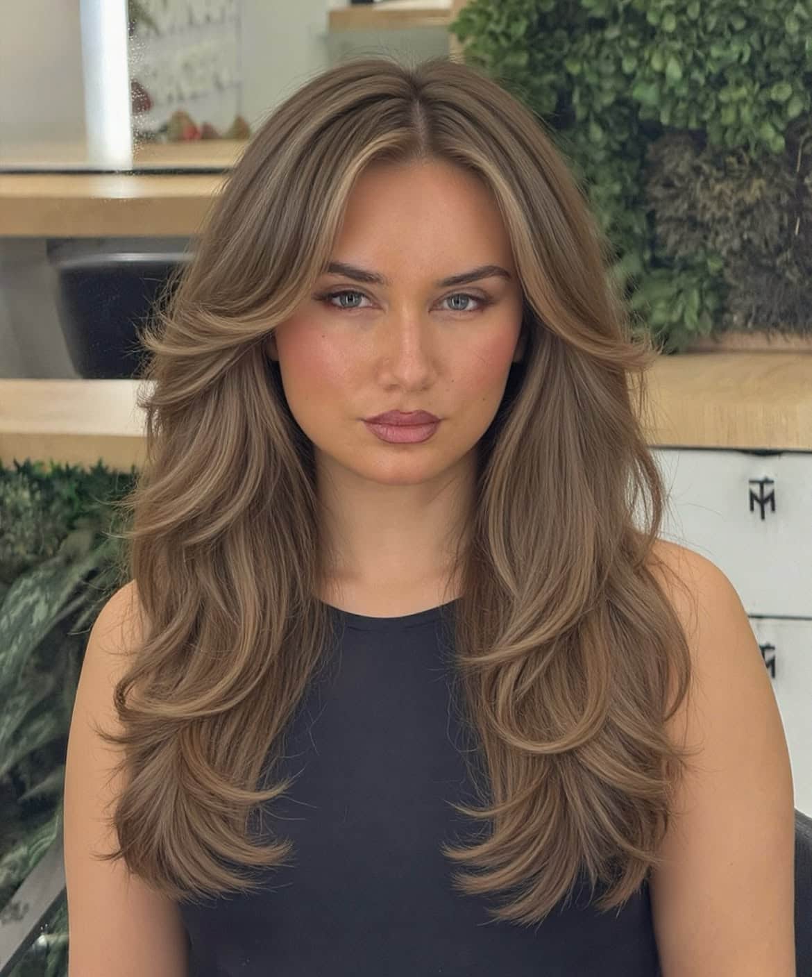 14. Sandy Brown Blowout with Curtain Bangs