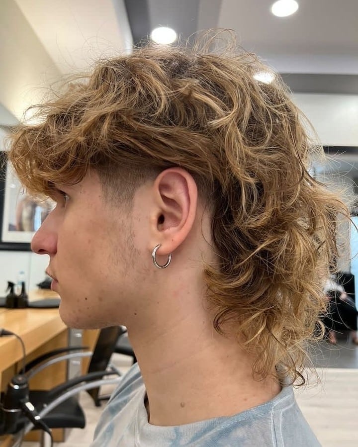 30. Shaggy Curly Mullet with Tapered Sides