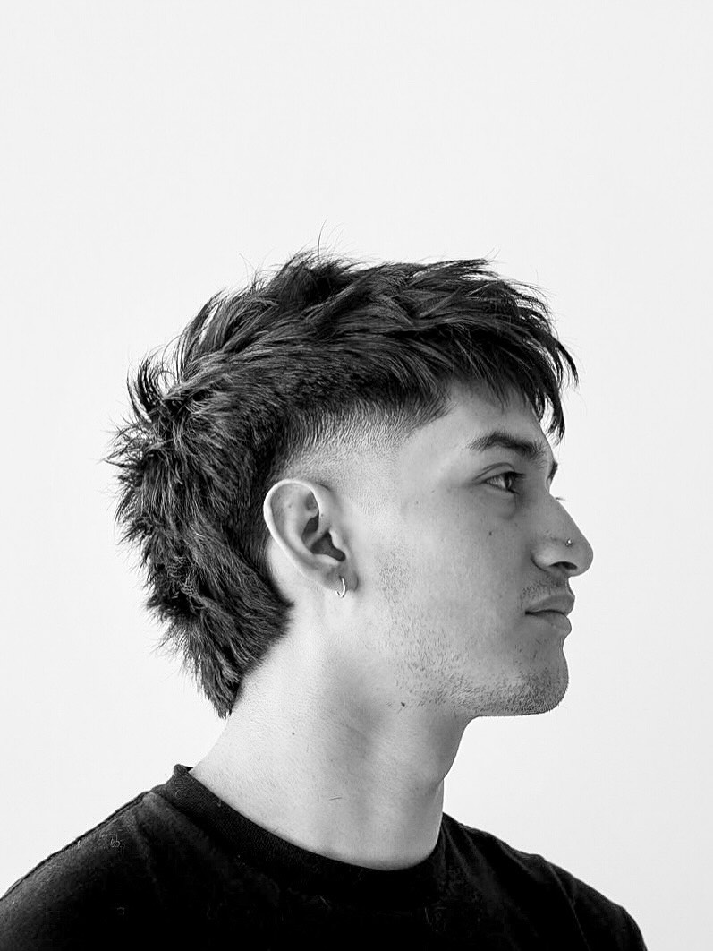 31. Shaggy Mullet Fade with Messy Fringe