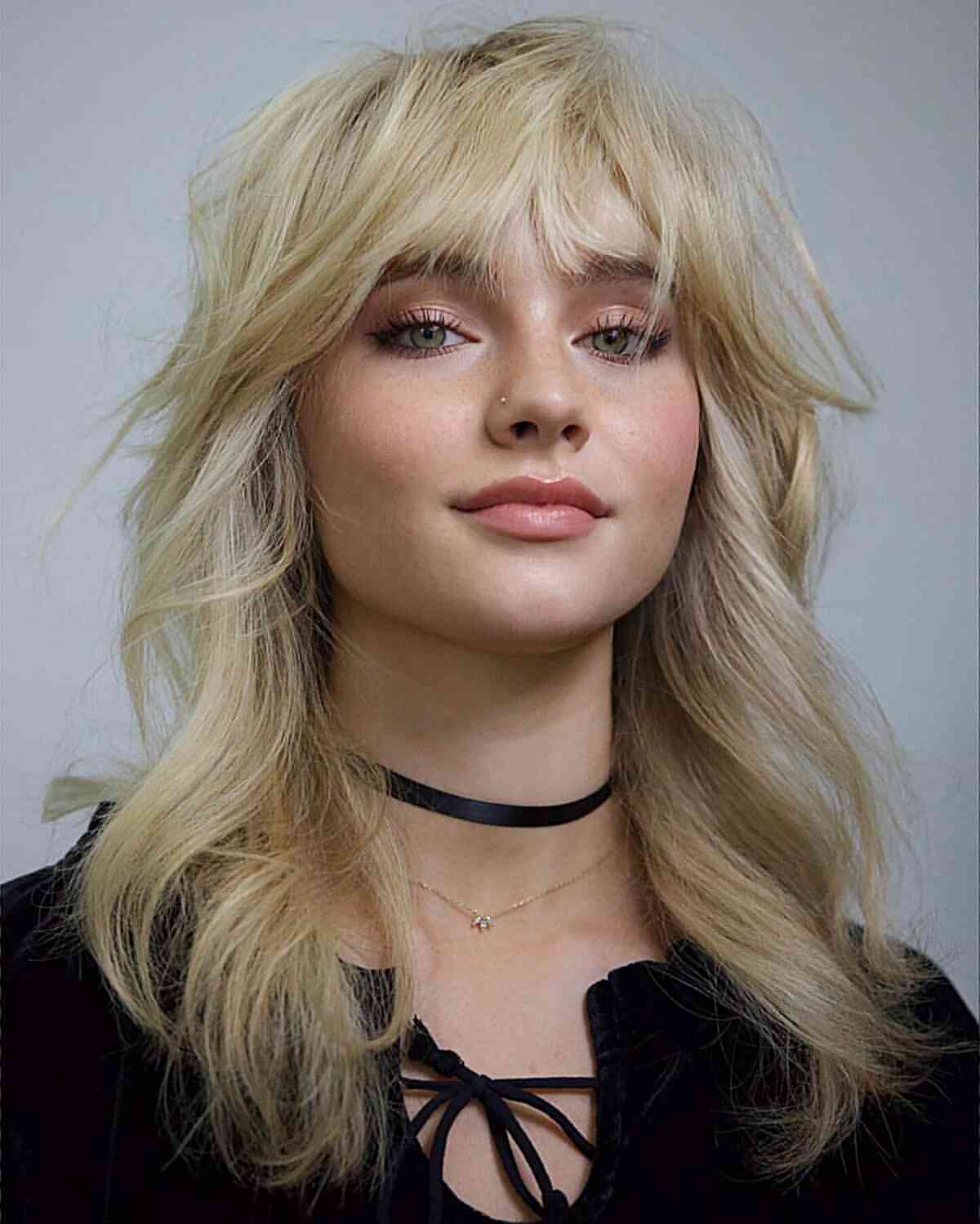 3. Shaggy Platinum Bottleneck Bangs
