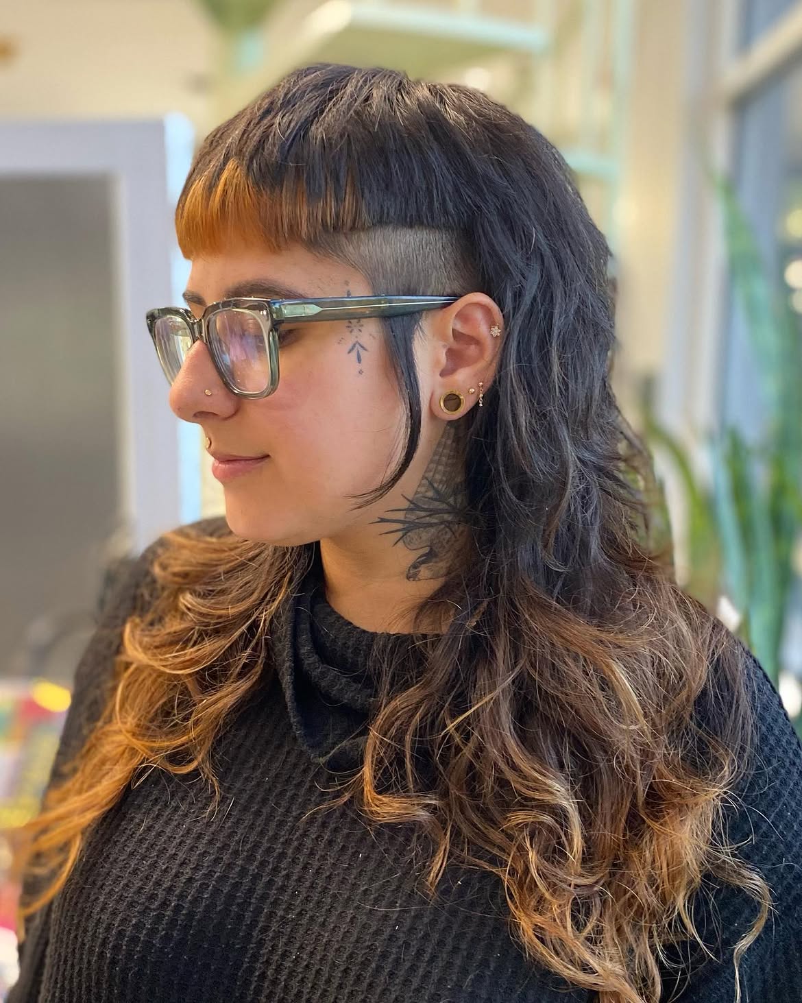 28. Shaved-Side Mullet with Blunt Baby Bangs