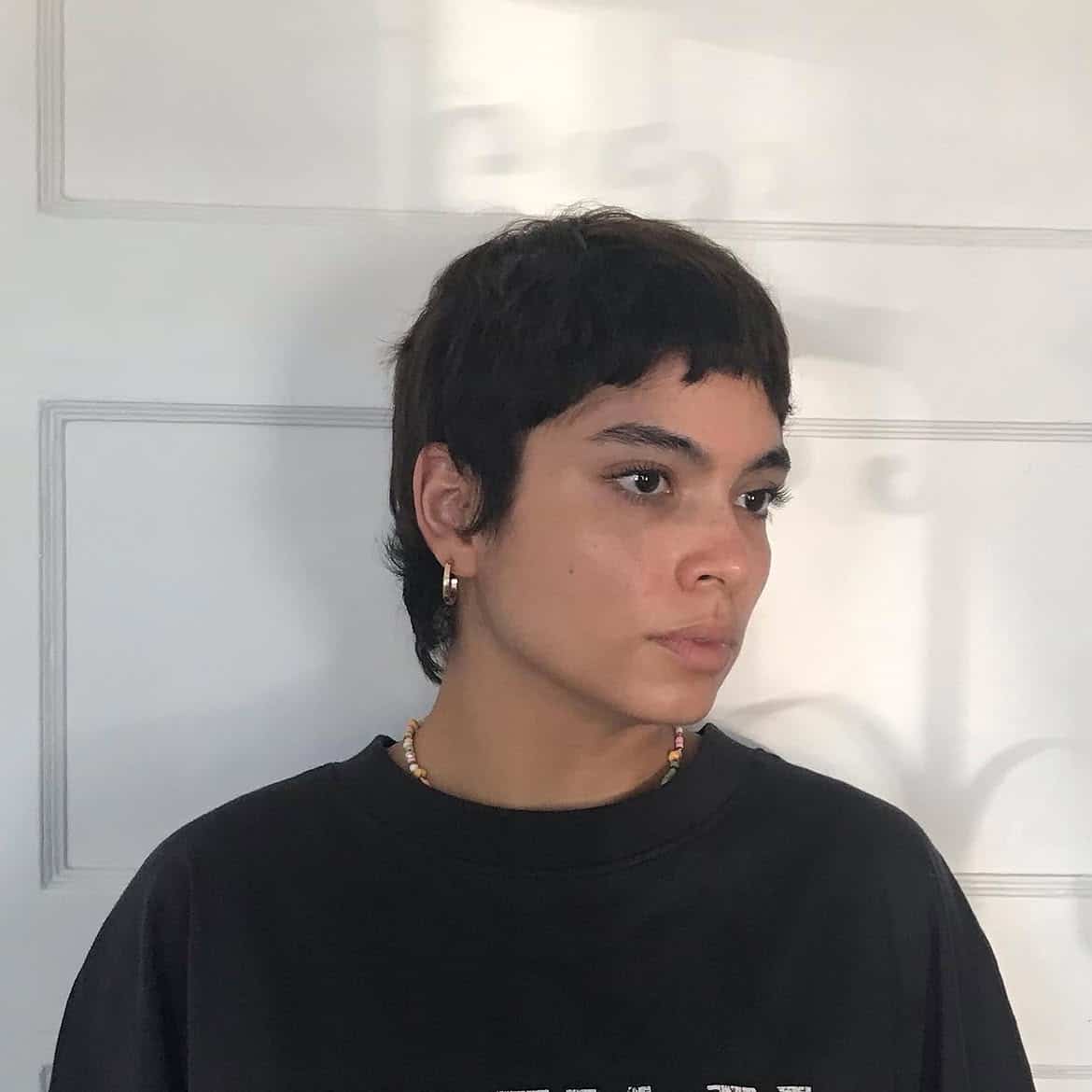 2. Short Shaggy Pixie Mullet with Baby Bangs