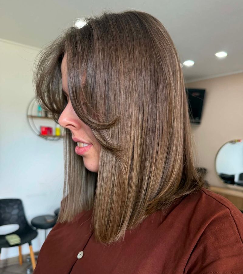 12. Silky Medium Brown Lob with Curtain Bangs