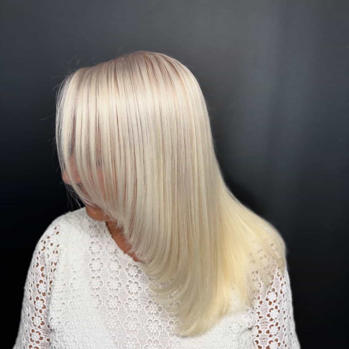 48. Sleek Creamy Blonde Layers