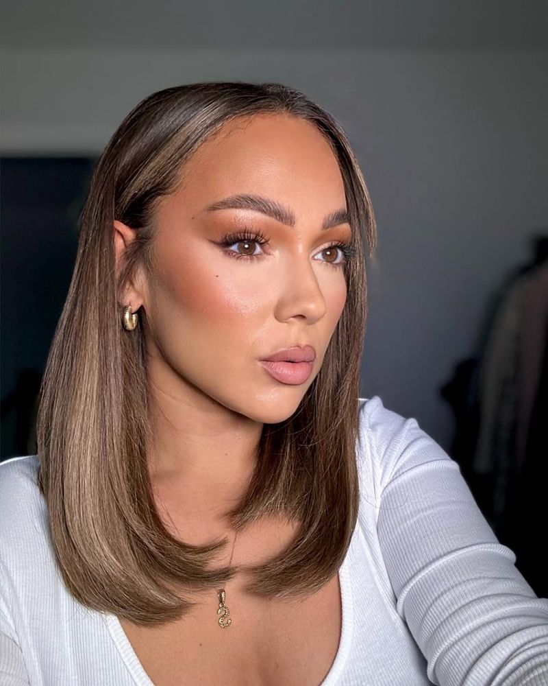 2. Sleek Honey-Highlighted Lob with Inward Ends