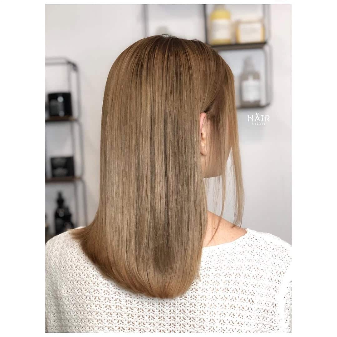 49. Sleek Honey-Tone Straight Cut