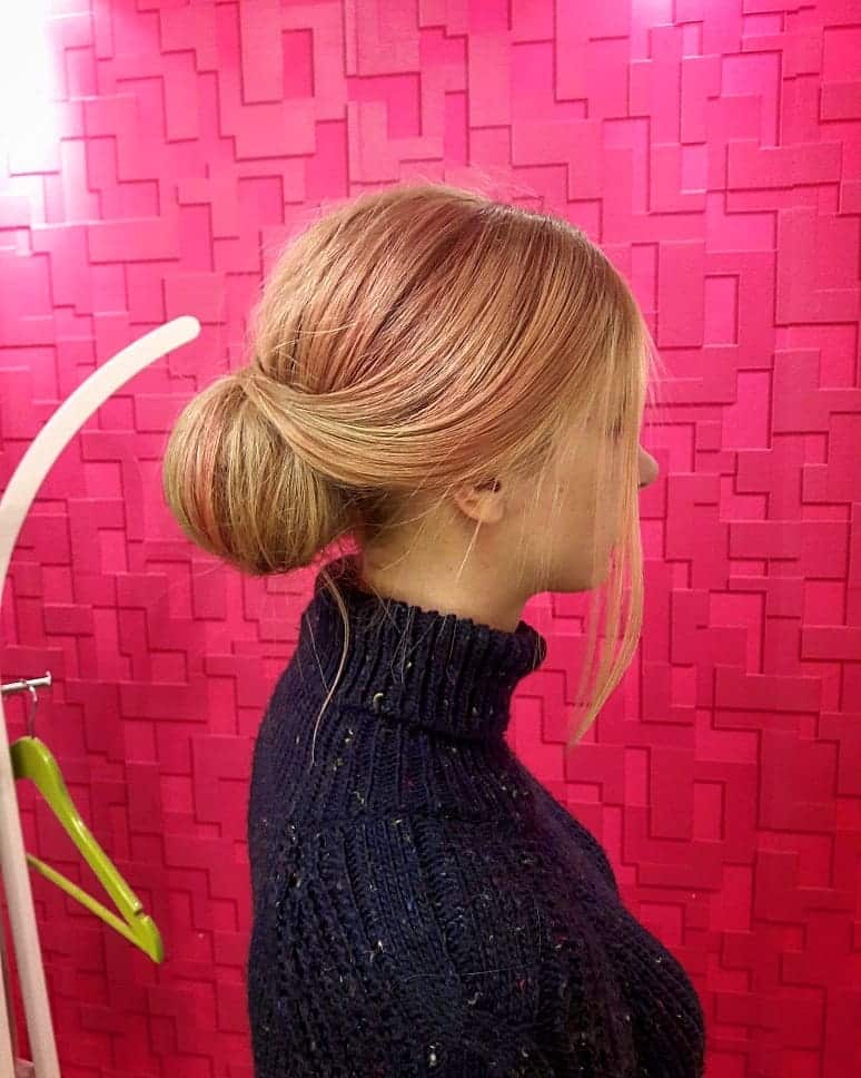 20. Sleek Low Chignon with Soft Front Pieces