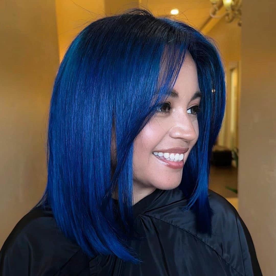 10. Sleek Shoulder-Length Blue with Soft Curtain Bangs