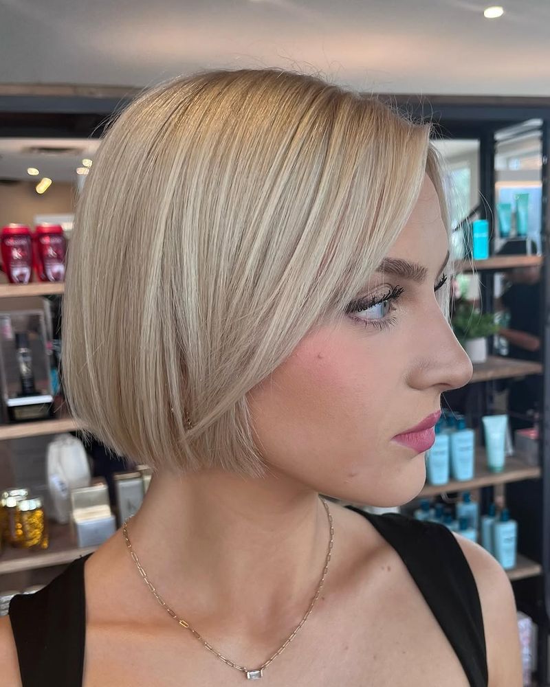 46. Sleek Side-Parted Platinum Bob
