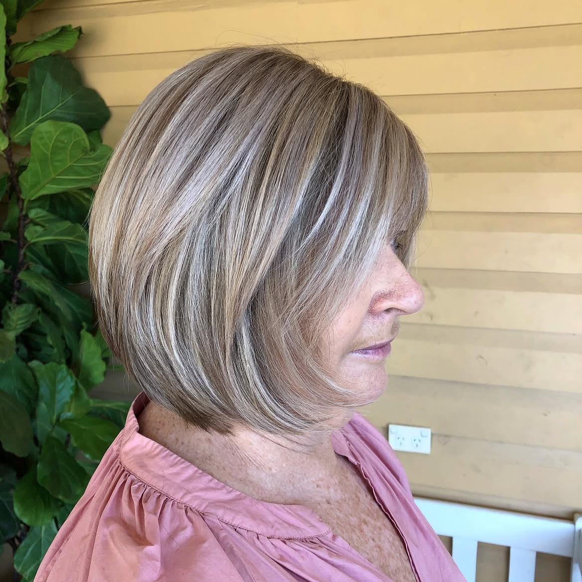 14. Sleek Stacked Bob with Bright Highlights