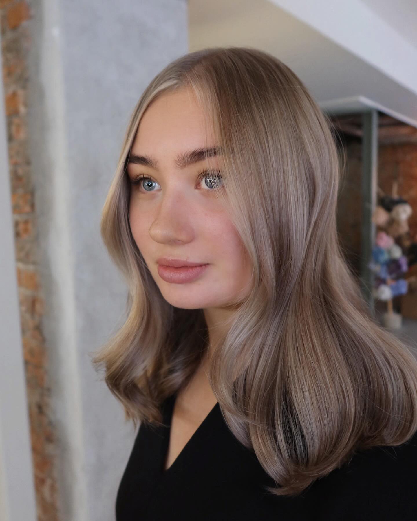 24. Smoky Ash Blonde with Face-Framing Money Pieces