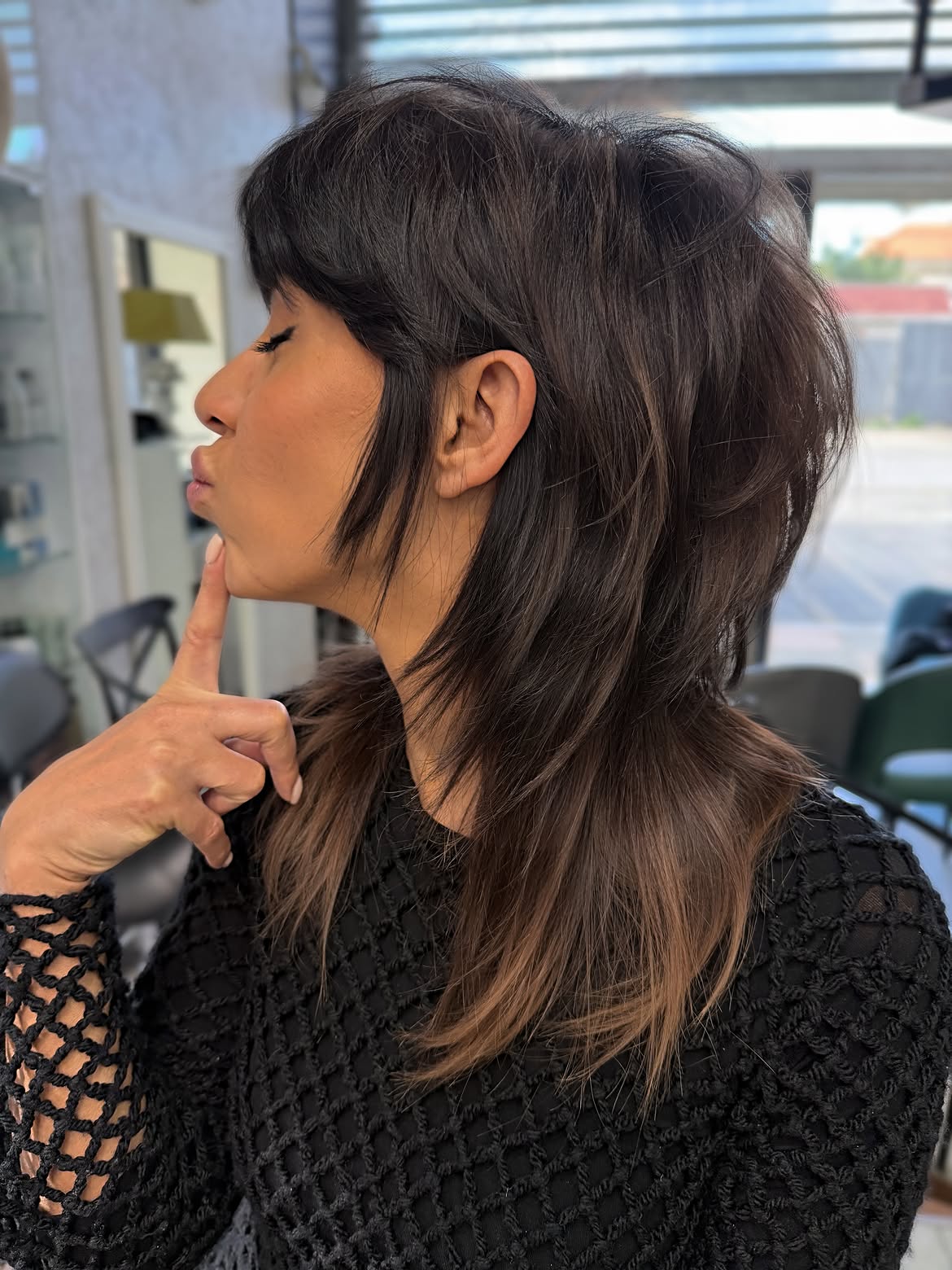 7. Smoky Brunette Shaggy Mullet with Wispy Side Bangs