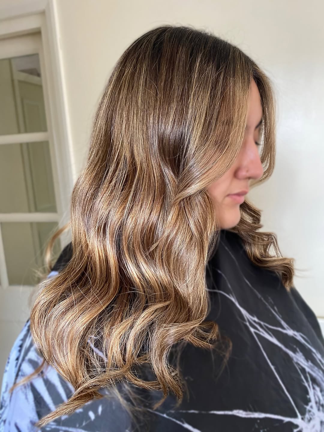 35. Soft Amber Waves with Face-Framing Highlights