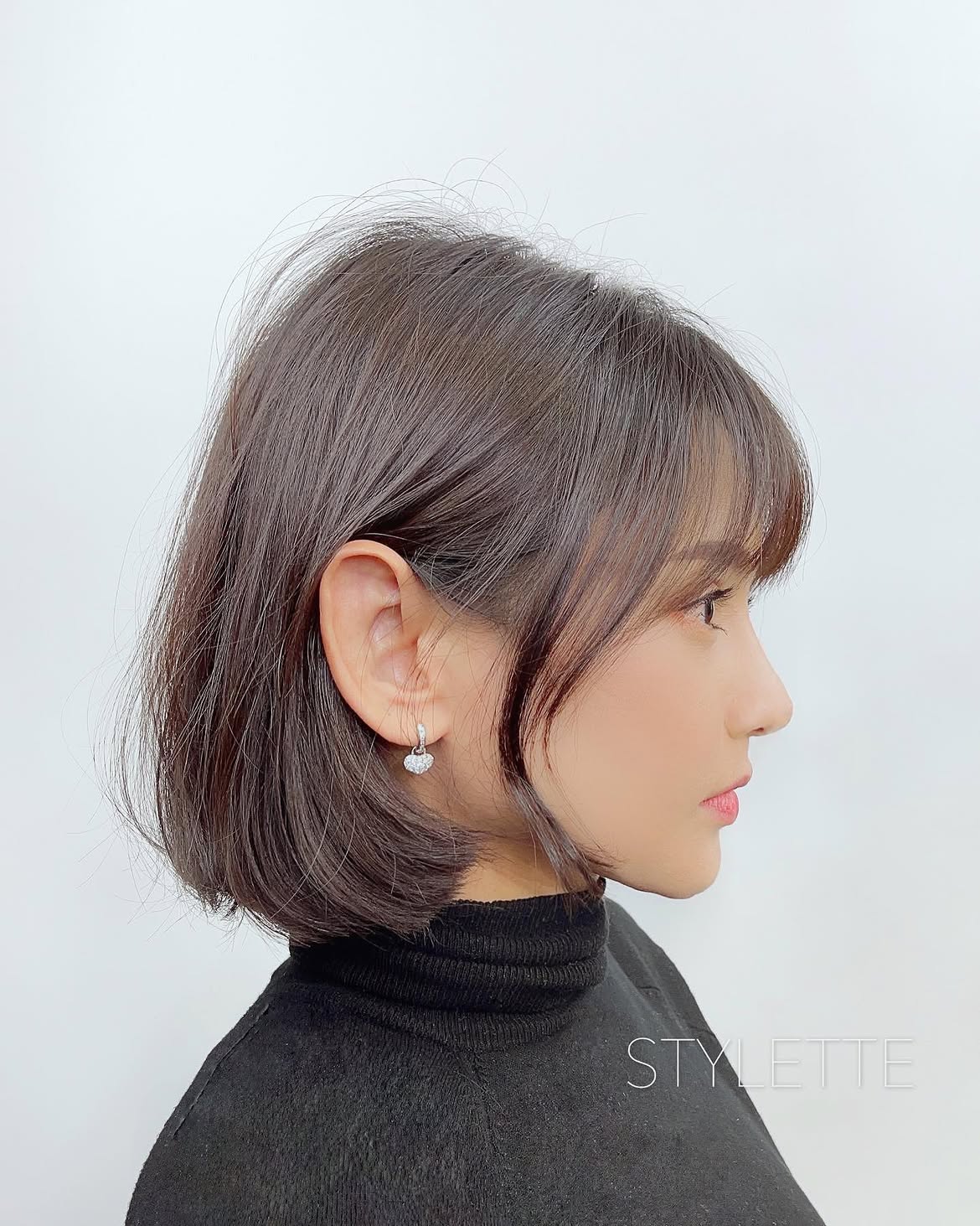 32. Soft Blunt Bob with Wispy Bangs