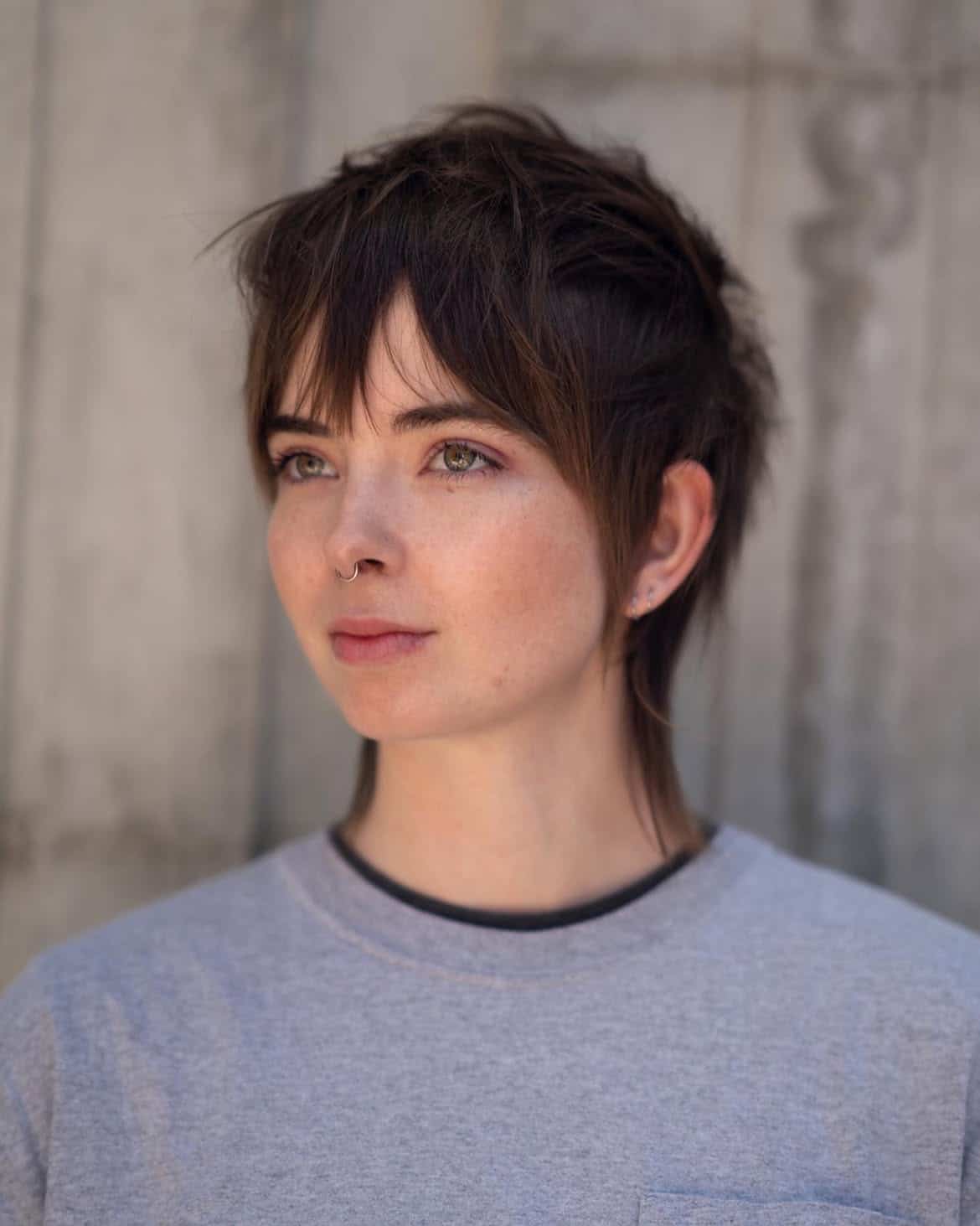47. Soft Brunette Pixie Mullet with Wispy Bangs