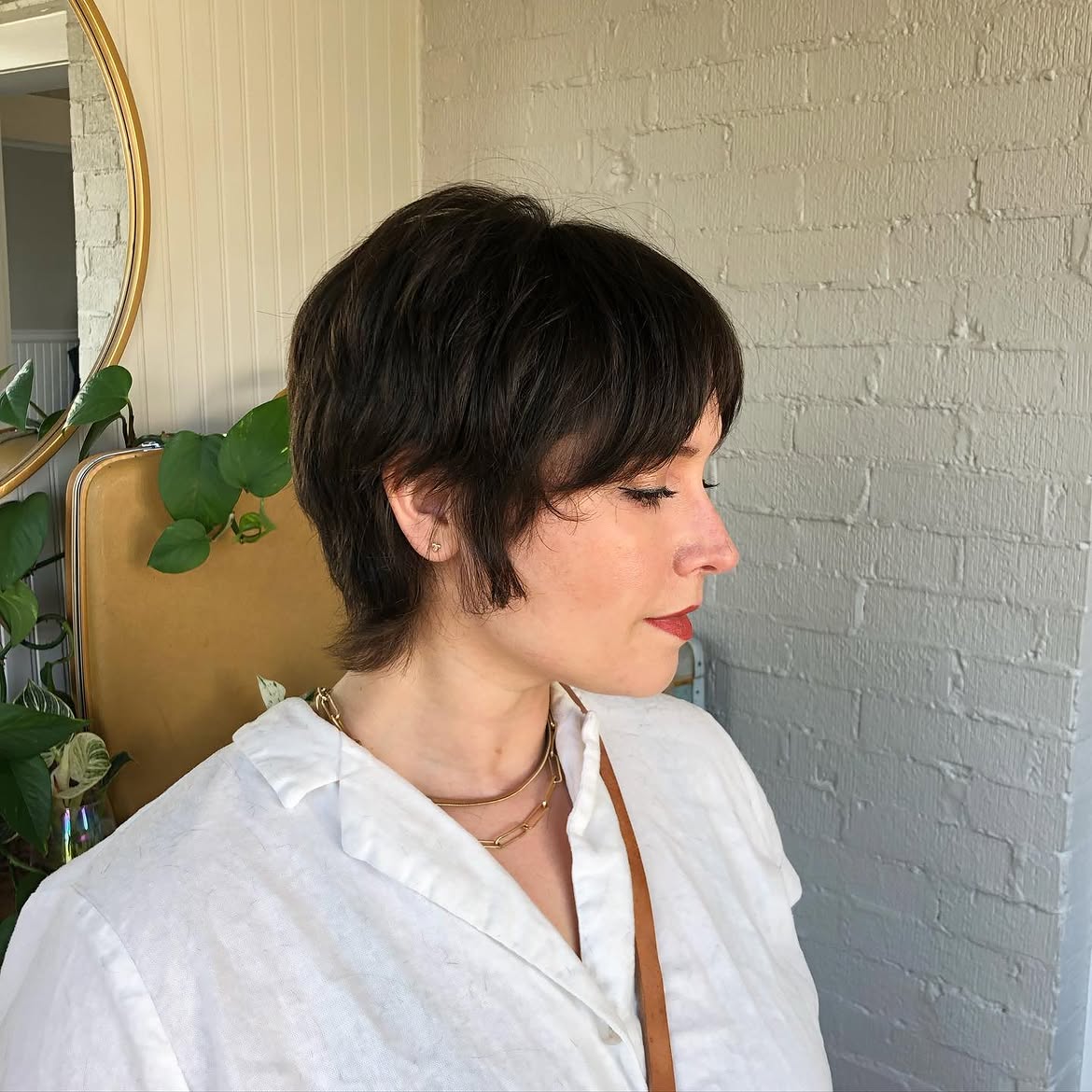 35. Soft Brunette Pixie Mullet with Wispy Nape