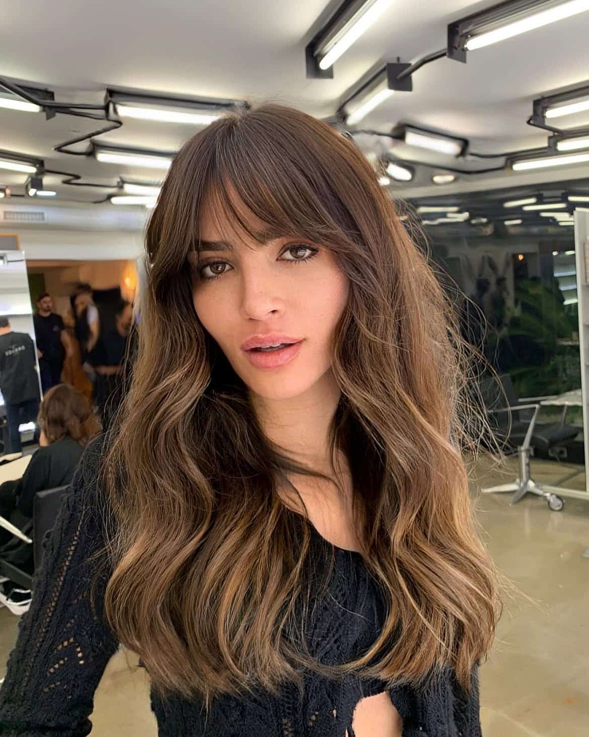 34. Soft Caramel Waves with Arched Fringe