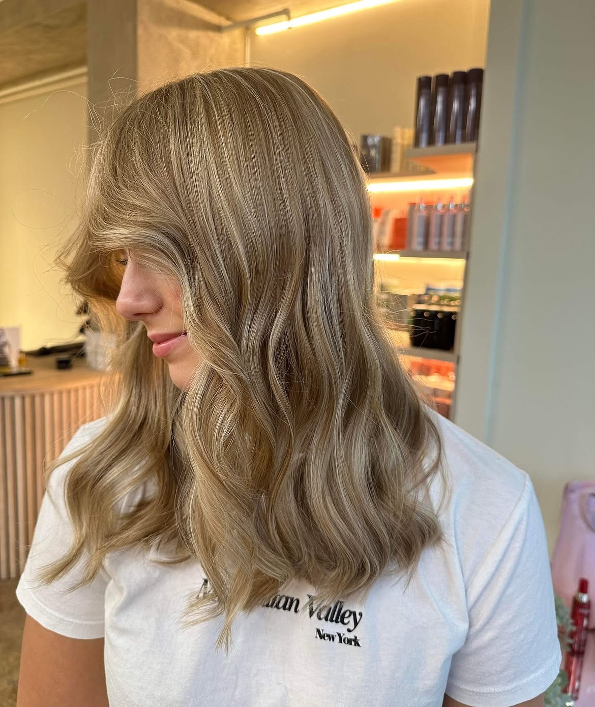 22. Soft Champagne Waves with Sweeping Fringe