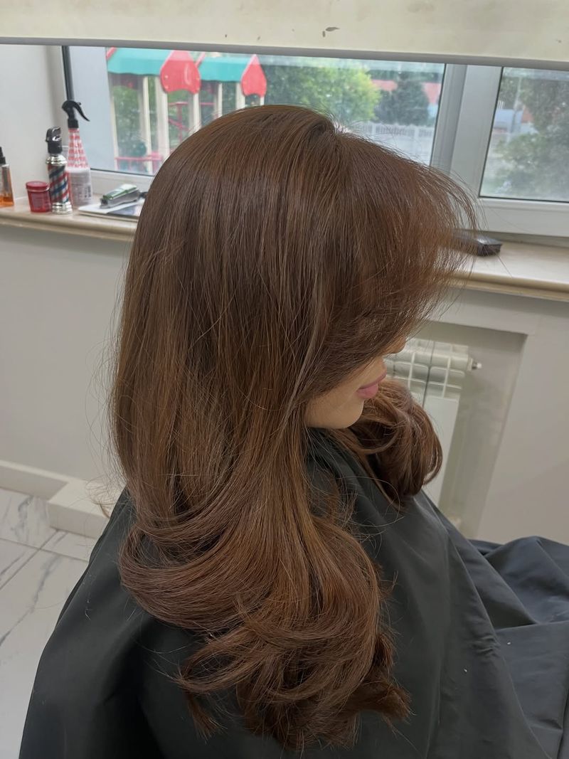 42. Soft Chestnut Blowout with Face-Framing Fringe