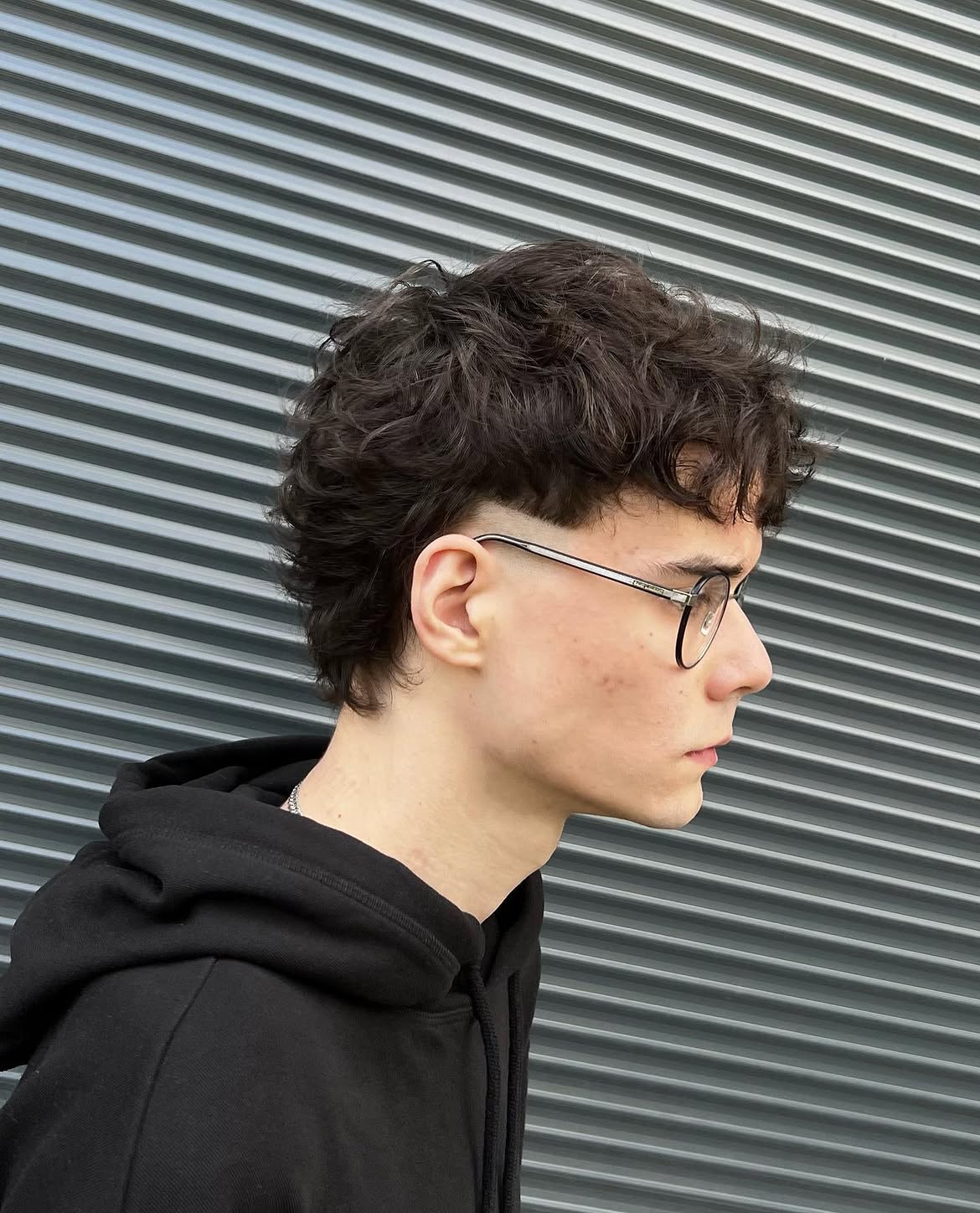 5. Soft Curly Mullet with Tapered Sides