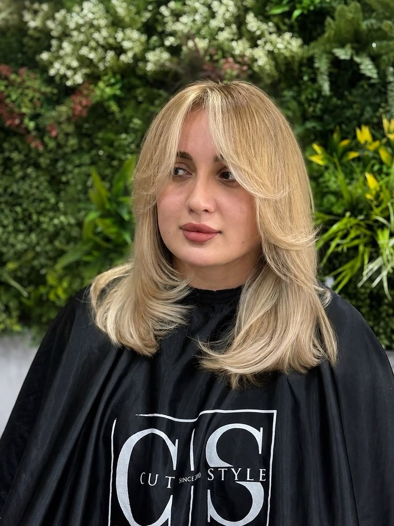 46. Soft Golden Layers with Long Curtain Bangs