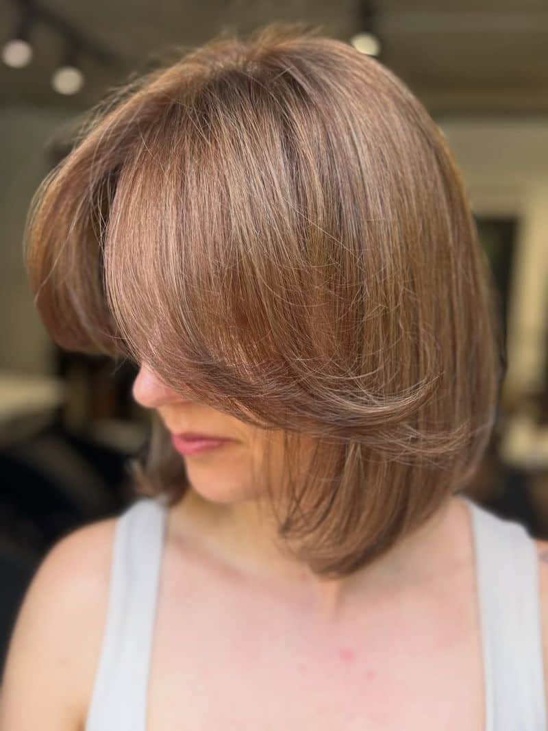 55. Soft Layered Bob with Curtain Bangs
