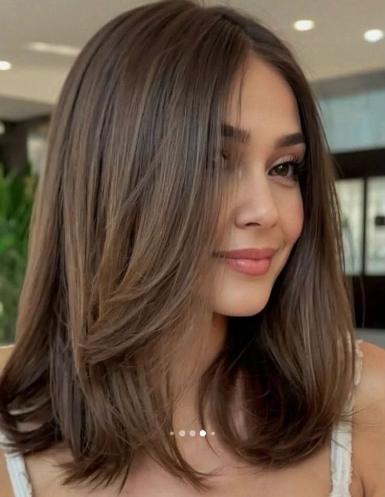 18. Soft Layered Lob with Curtain Bangs
