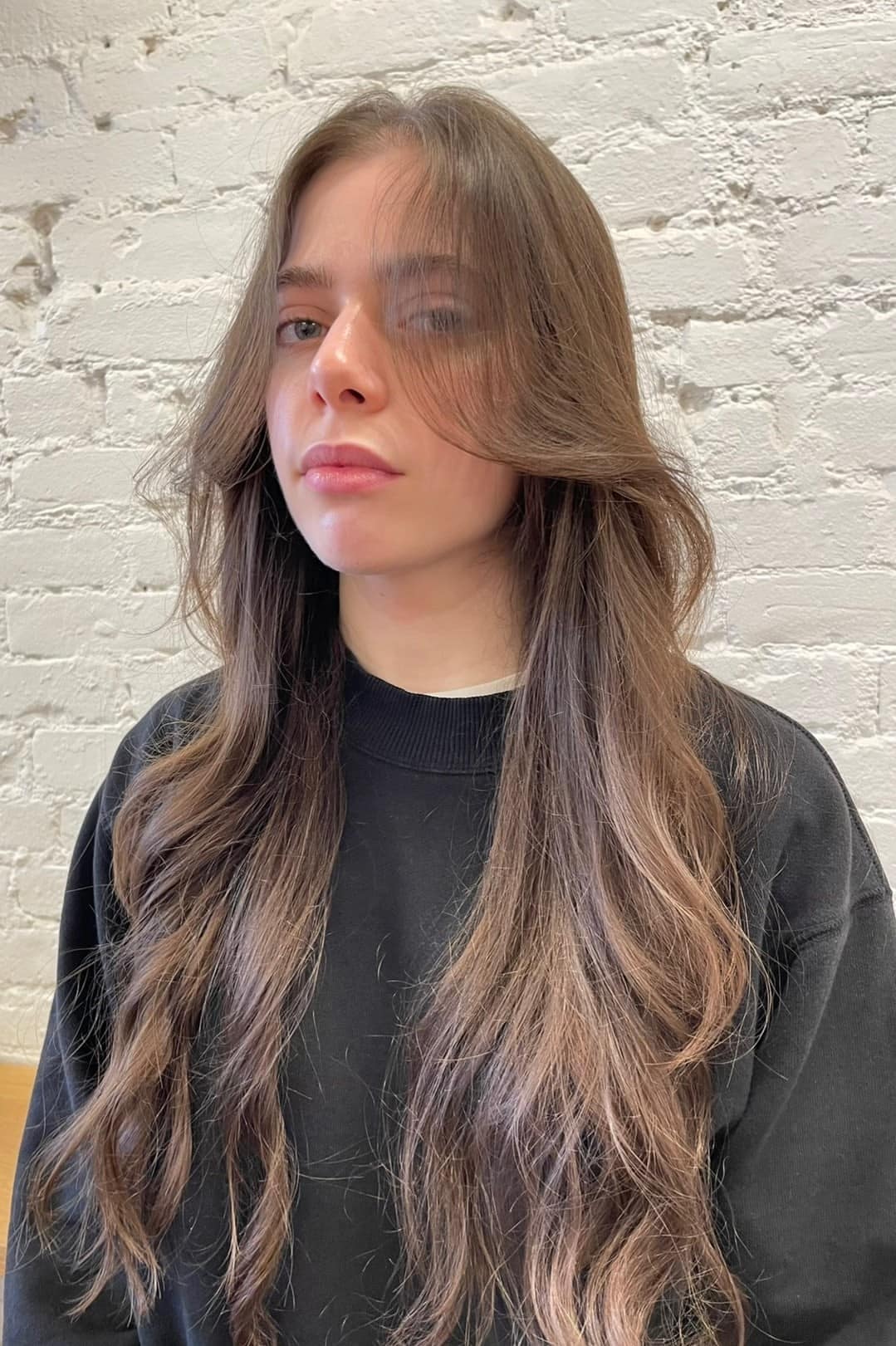 3. Soft Long Layers with Curtain Bangs