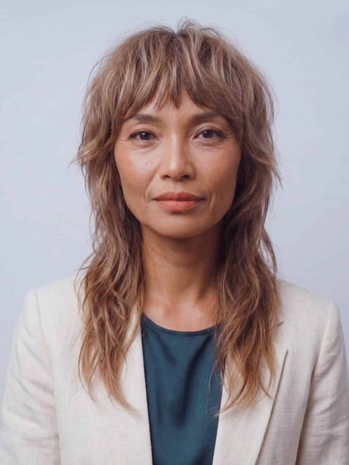 35. Soft Wavy Mullet with Wispy Bangs