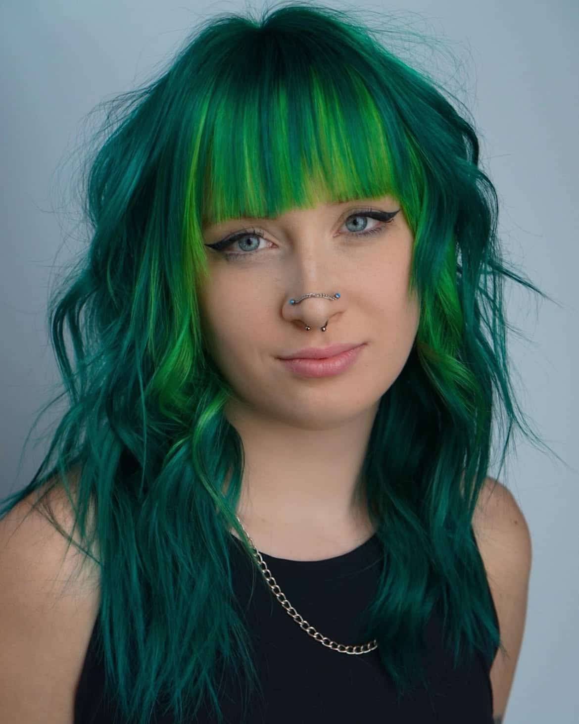 33. Teal Shag with Lime Money Piece Bangs