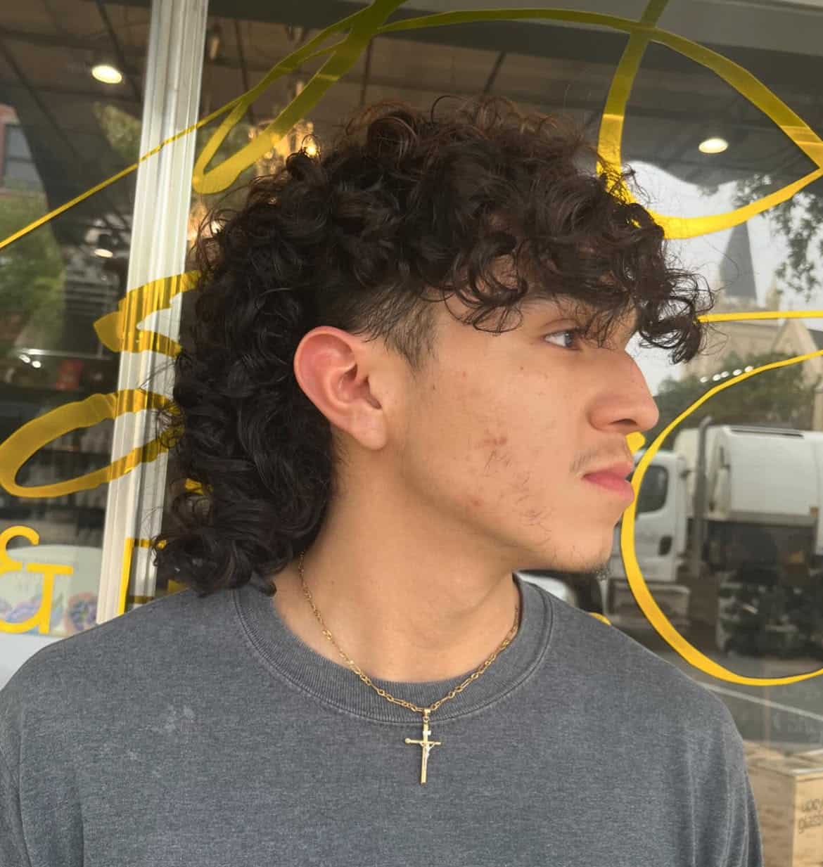 14. Temple Fade Curly Mullet with Heavy Fringe